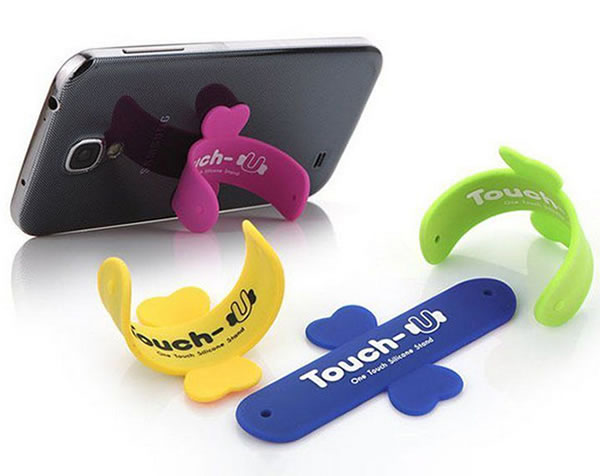 Soporte adhesivo en forma de U de silicona para smartphone ¡¡¡Touch-U ® es un original soporte manos libres portátil, pensado para que puedas visualizar mejor las películas y tus vid